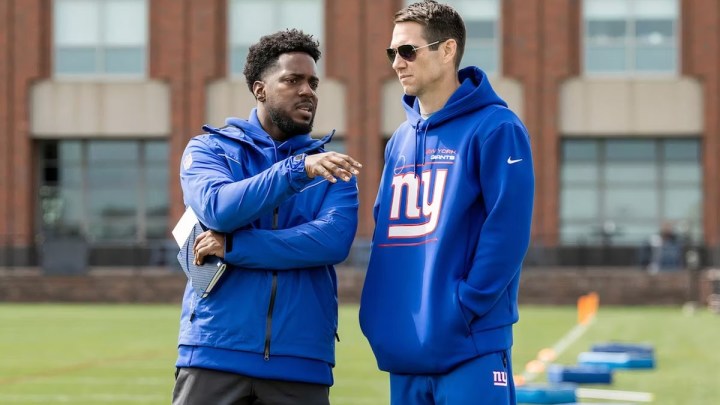Two members of the New York Giants confer in Hard Knocks: Offseason with the New York Giants.