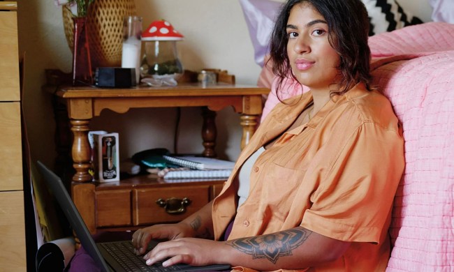 A woman using the HP 15.6-inch N200 Laptop.